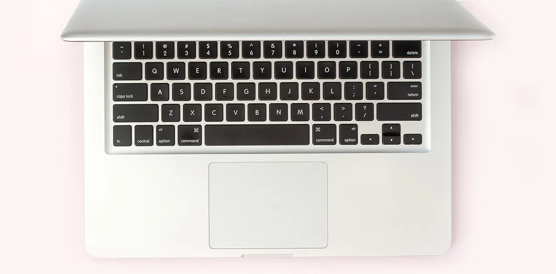 Laptop on a pink background